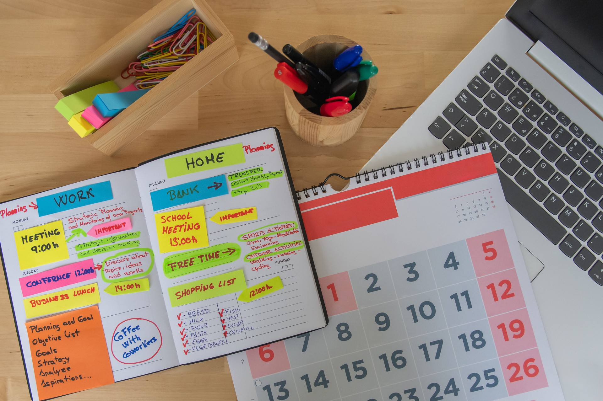 Organized Desk: Open Planner, Calendar, And Laptop, Highlighting Colorful Goals, Work-Life Balance, Productivity, And Clear Task Management For Professionals And Home Organizers Alike.